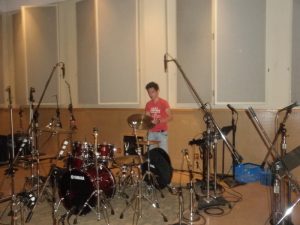 Selim Munir setting up drums at Sunset Sound for recording